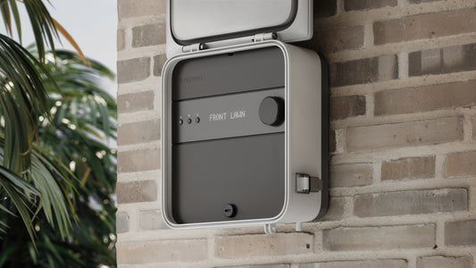 Image of Irrigreen's premium Smart Controller 3 installed on the exterior wall of a home or building, featuring new smart-touch control panel for a sleeker, more user-friendly utility and overall design.