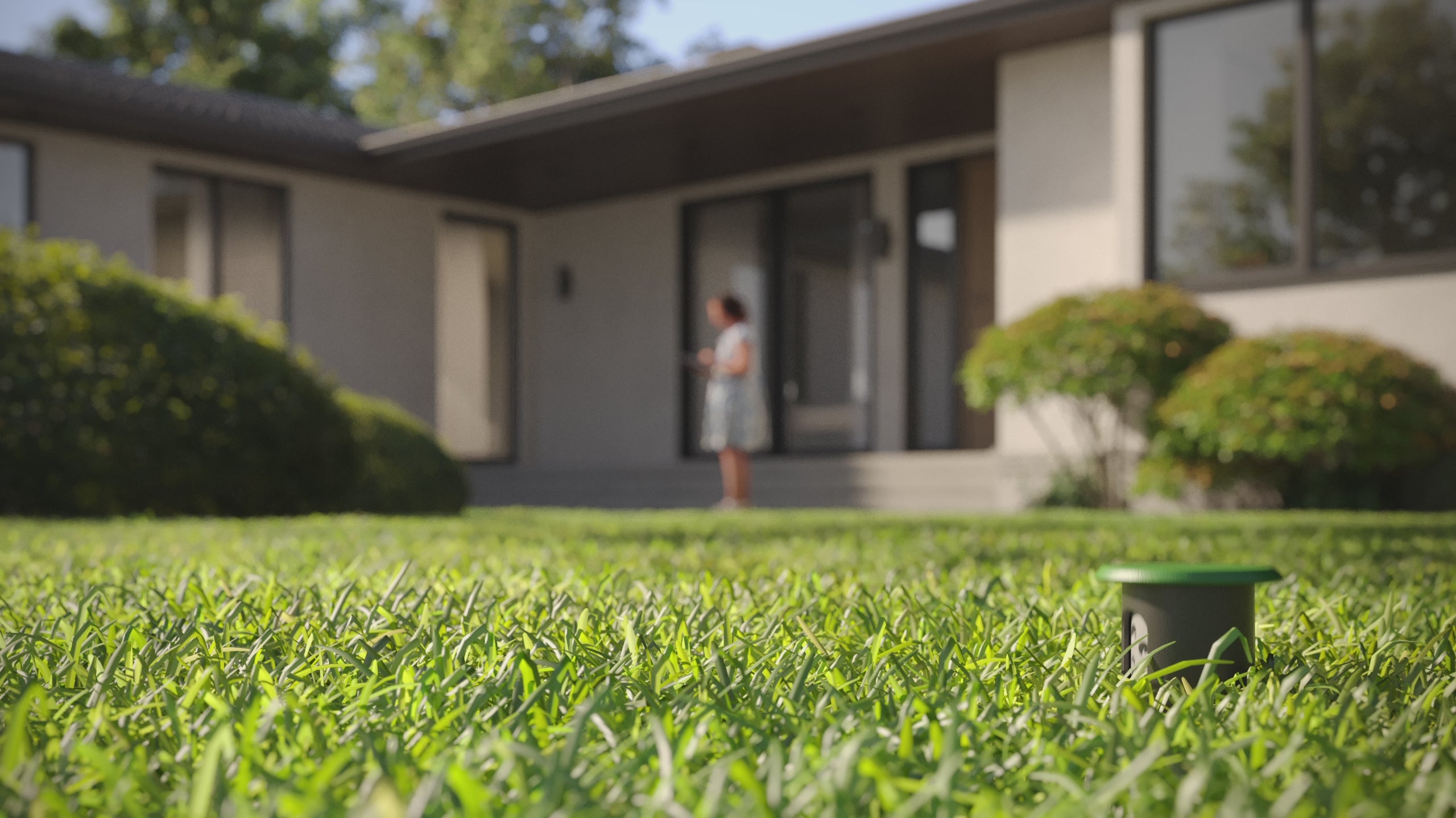Irrigreen Smart Sprinkler Head 3 in action popping out of ground and spraying water out of it's 16-port nozzle